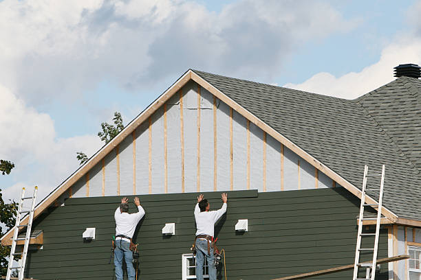 Professional Storm Damage Siding Repair technician working in Newton, IL